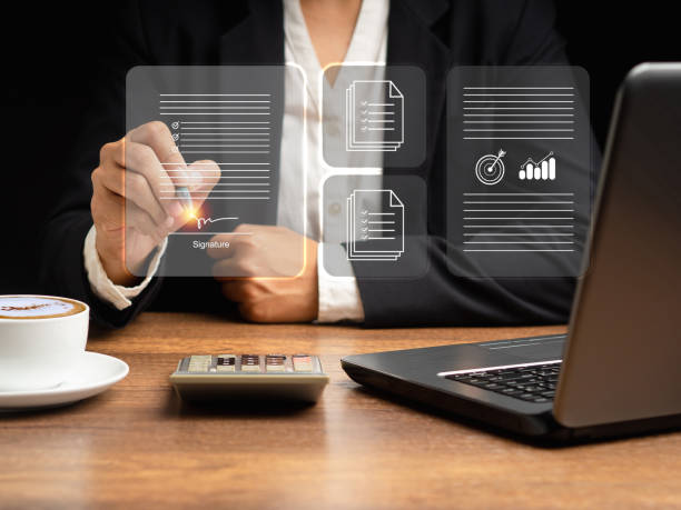 istock A businesswoman uses a pen to sign electronic documents on digital documents on a virtual screen. Electronic signature and paperless office concept 1628574292