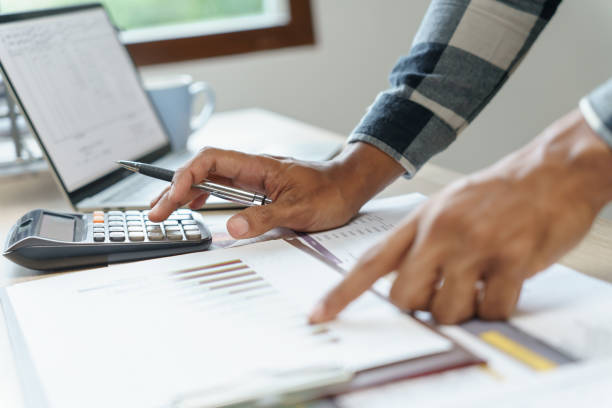 istock Attractive confident Hispanic Business man using laptop computer and professional working investor start up project business planning in office 1628619475