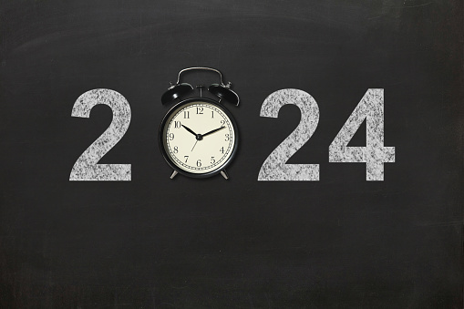 New year 2024 start alarm clock blackboard