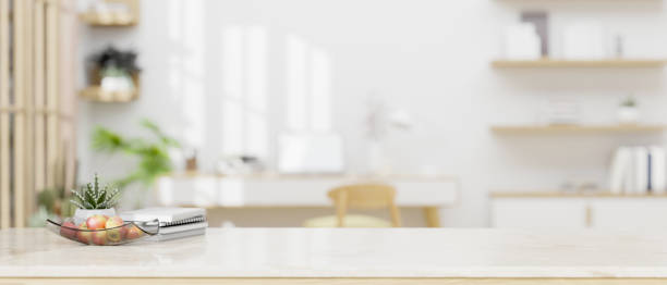 istock A white tabletop over a blurred, modern, bright home office workspace in the background. 1628685507