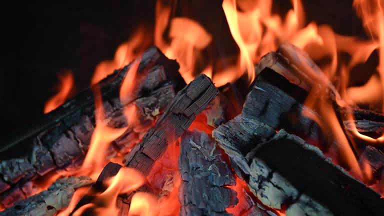 Close-up of a fire burning in a fireplace.