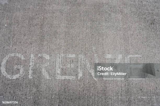 Border On A Gray Background Lettering Border On A Concrete Surface Stock Photo - Download Image Now