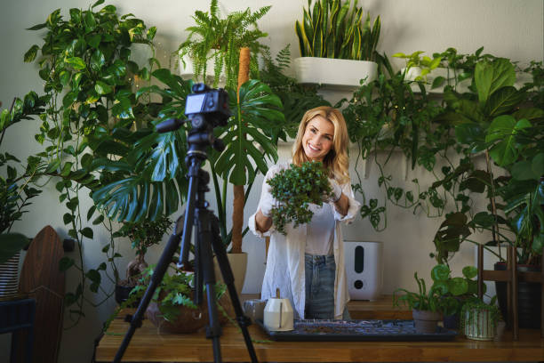 istock Florist blogger capturing her plant care routine in room with vibrant greenery 1628716936