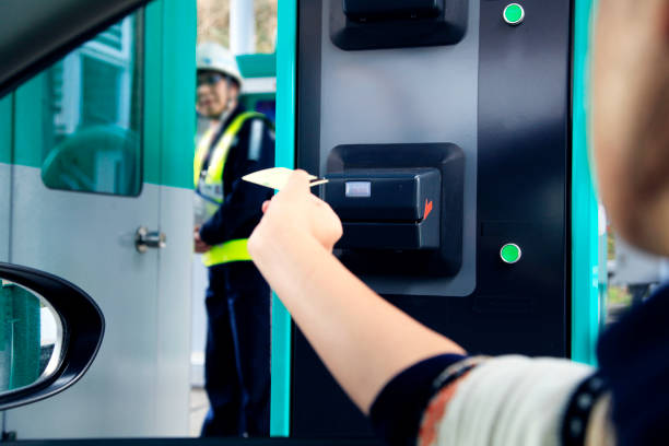 istock The driver is picking up the expressway card. Using Japan's expressways 1628775171