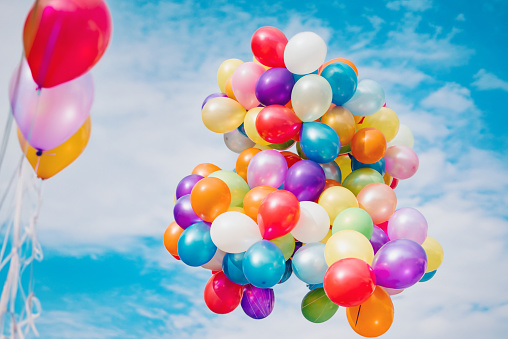 colorful balloons on a blue sky background