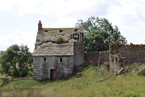 Abandoned farmhouse in remote countryside