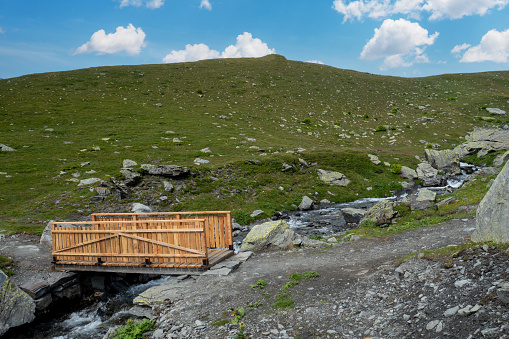 a small footbridge in the french Alps mountains