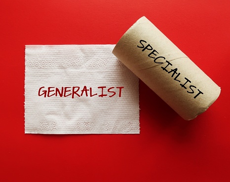 Toilet paper roll with handwritten text GENERALIST and SPECIALIST, refers to one who is knowledgeable various interests topics or skills, versus one who expert in certain field of study or occupation