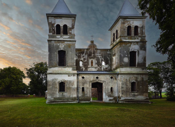 istock Ruined old catholic church. Evening sky. 1628833393