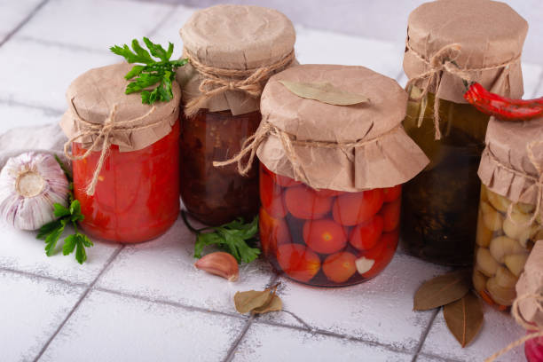 istock Pickled vegetables in glass jars. 1628838242