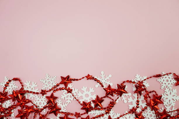 istock Christmas Ornament border frame on pink background 1628840403