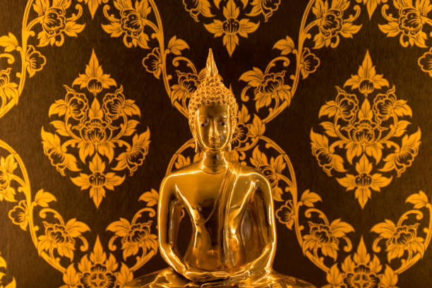 Buddha statue with warm lighting decoration in Thai house for praying.