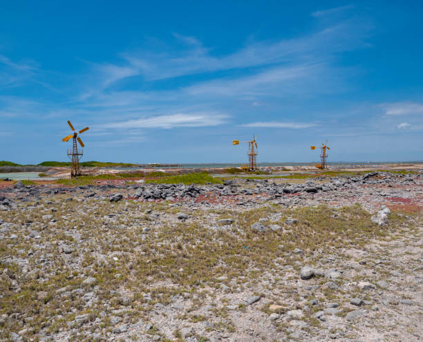 istock Three yellow/orange iron windmills on the South side on Bonaire. 1628878348