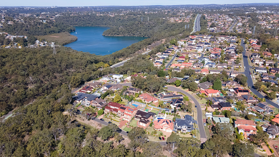 Aerial drone view of Alfords Point in the Sutherland Shire, South Sydney, New South Wales, Australia looking from above Georges River in the south direction