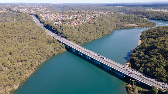 Aerial drone view of Alfords Point Bridge across Georges River in Southern Sydney, New South Wales, Australia showing the suburb of Alfords Point