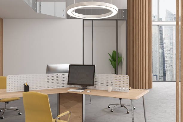 istock White office room interior with pc computer on desk, plant and panoramic window 1628885641