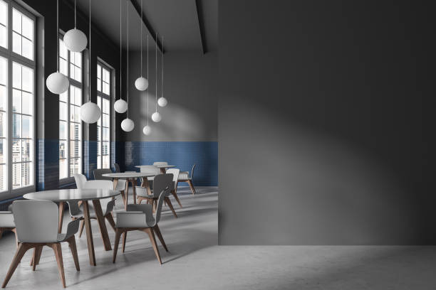 istock Dark restaurant interior with table and chairs in row, window. Mock up wall 1628900034