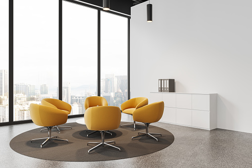 Cozy business interior with armchairs and table, side view drawer with folders. Meeting corner with panoramic window on Kuala Lumpur. Mock up copy space wall. 3D rendering