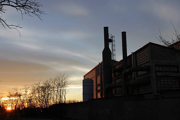 chimneys at sunset stock photo