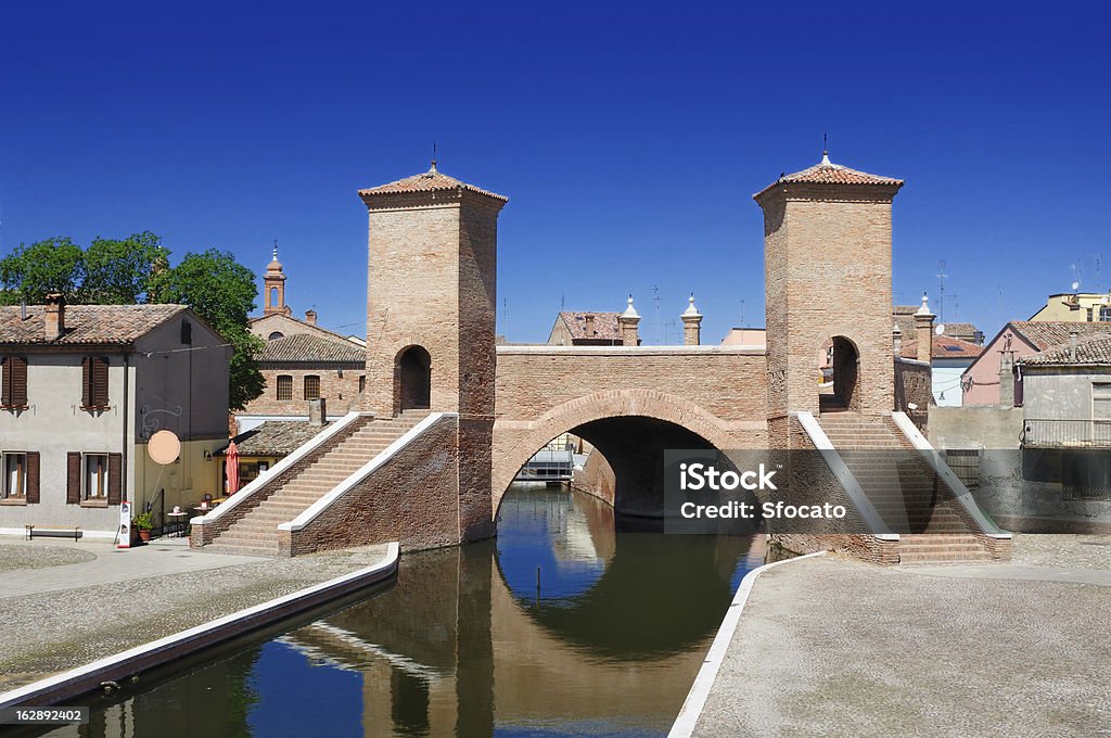 Trepponti bridge of Comacchio, Ferrara, Emilia Romagna, Italy View of the historical Trepponti bridge, symbol of Comacchio, Ferrara, Emilia Romagna, Italy, Ancient Stock Photo