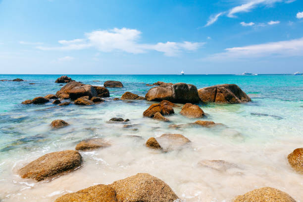 istock Tropical Beach with Clear Blue Water and Rocks in Phuket. 1628926899