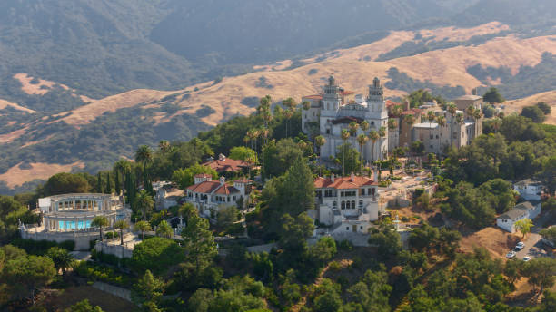 San Simeon, California / USA - December 22, 2022: Aerial view of Hearst Castle during sunny day.\n\nHearst Castle, known formally as La Cuesta Encantada (Spanish for \