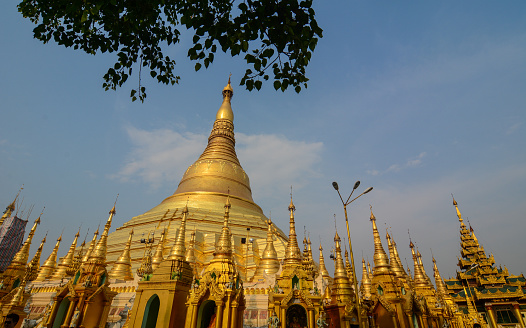Golden Stupa of Shwedagon Pagoda at sunny day in Yangon, Myanmar.