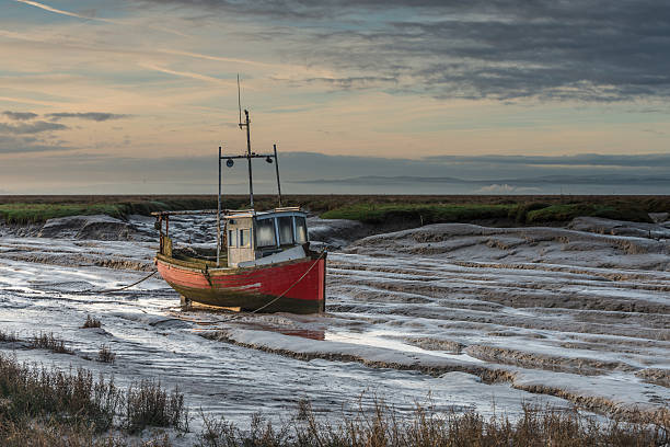 istock Stranded fishing boat on the Dee estuary 162894616
