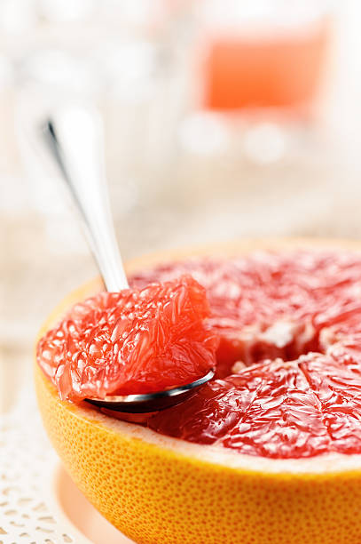 Piece of red grapefruit, citrus dessert stock photo