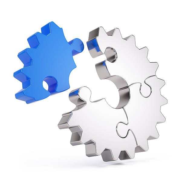 istock Four puzzle pieces making up a gear 162895129