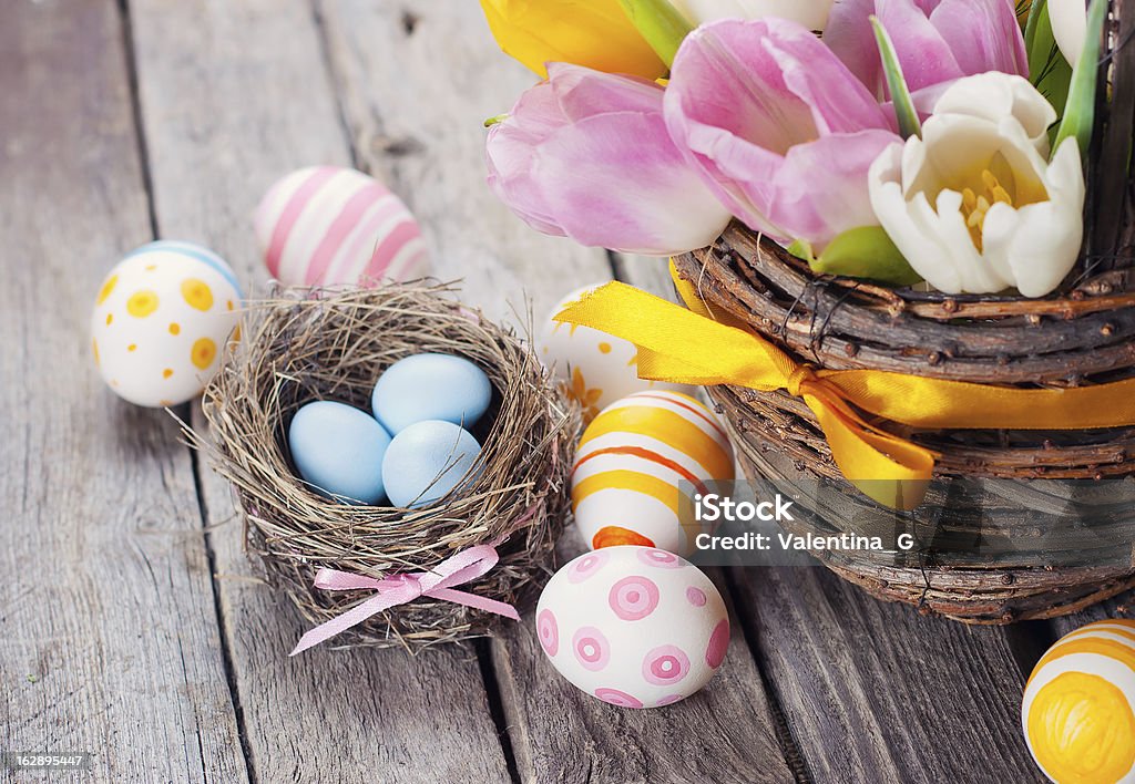 Easter Colorful  Easter eggs on a wooden background Animal Nest Stock Photo