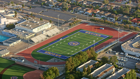 Santa Clara, California / USA - December 22, 2022: Aerial view of football field of Santa Clara Highschool.\n\nA football pitch (also known as soccer field) is the playing surface for the game of association football. \n\nSanta Clara High School is a public high school located in Santa Clara, California, United States. It is one of four high schools in the Santa Clara Unified School District (SCUSD).