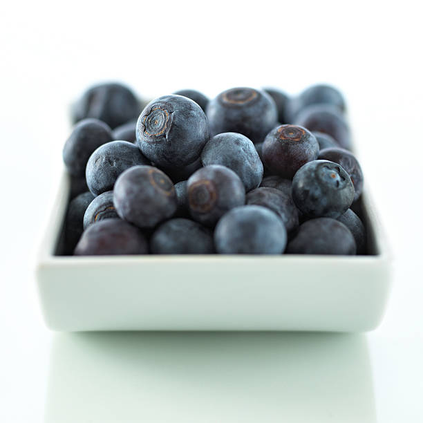 Blueberries in a bowl stock photo