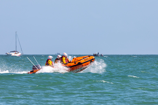 Cape Town , South Africa- 05 August 2023. Photo of a Rescue team on a motor boat in the Ocean in Gordon's Bay, South Africa
