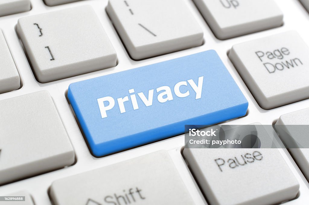 Privacy on keyboard Blue privacy key on keyboard Color Image Stock Photo