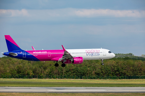 Budapest Hungary AUG,19. 2023: Wizzair Airbus-320 just landing at a very busy Budapest International airport.
