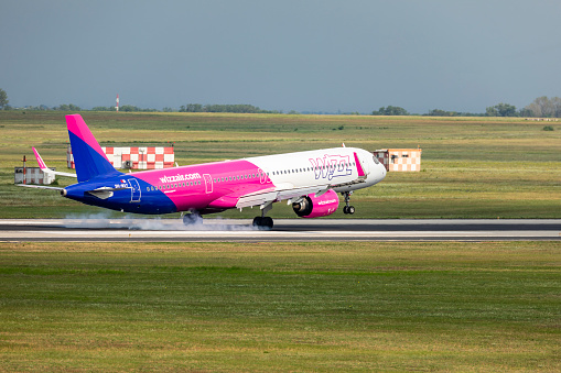 Budapest Hungary Aug,19. 2023: Wizzair  Airbus-320 just taxiing for takeoff at a very busy Budapest International airport.