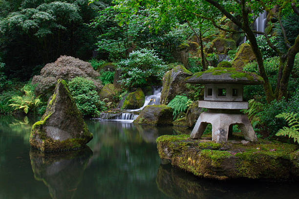 Pond and waterfall in Japanese garden Pond and waterfall in Japanese garden portland japanese garden stock pictures, royalty-free photos & images