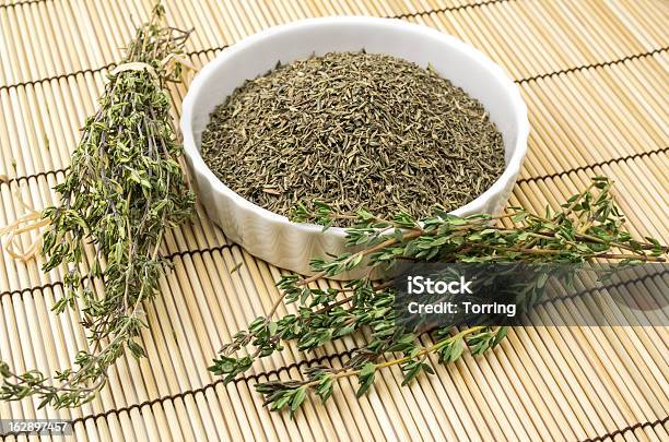 Dried And Fresh Thyme Stock Photo - Download Image Now - Bowl, Bunch, Crockery