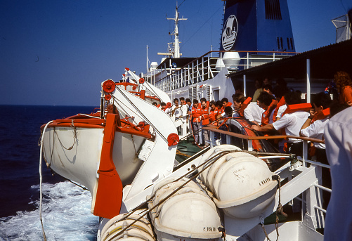 Aegean Sea - aug 1990:  abandon ship simulation with lifeboats while sailing on a scheduled ferry between the islands of the Aegean Sea.
