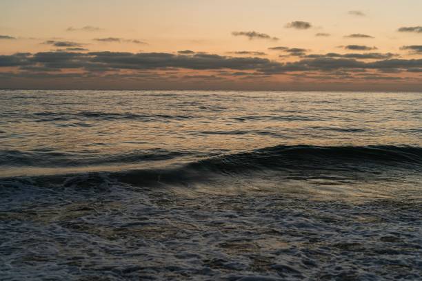 istock Surreal sunset over the ocean with a pristine sky. 1628989967