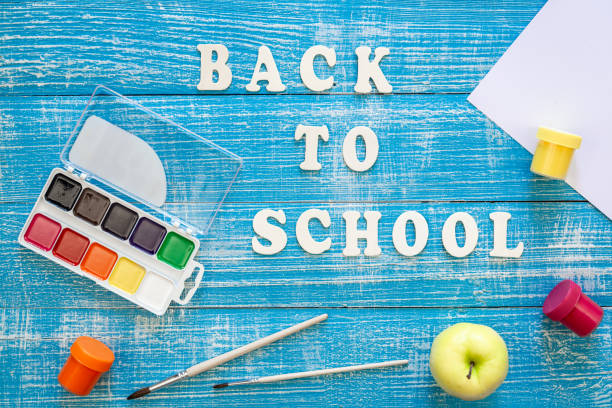 istock Back to school concept on wooden blue background, top view. 1628992109