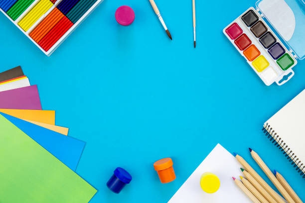 istock Various school education and office supplies, accessories on a blue background. 1628995351
