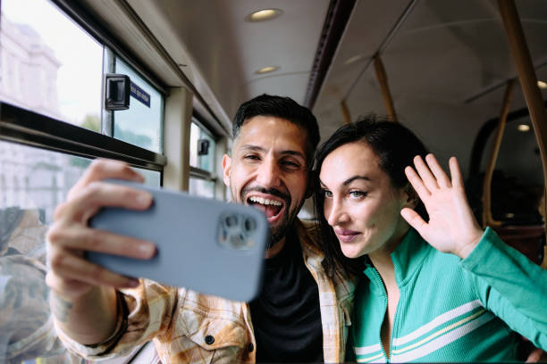 istock Tourists taking selfie on bus 1629015049