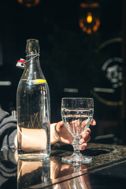 istock Drink water bottle with glass on table in the restaurant. 1629023289