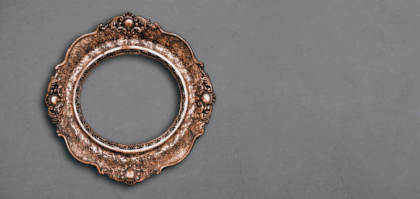 istock Vintage luxury golden frame with ornate baroque decoration on rustic textured background. 1629028705