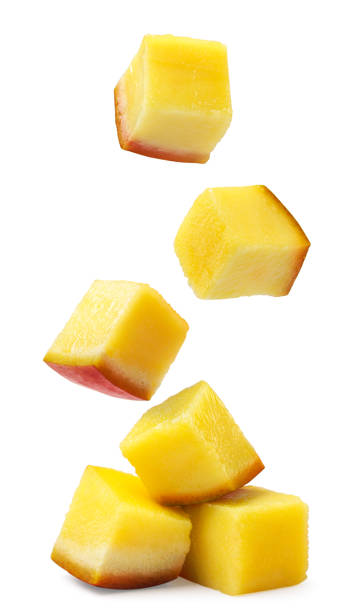 istock Pieces of mango fall on a pile on a white background. Isolated 1629029282
