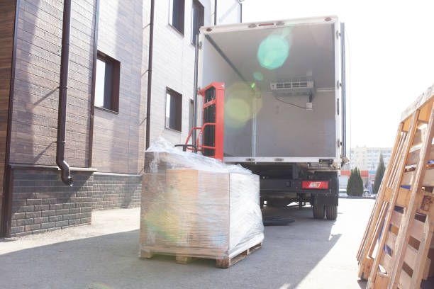 istock loading some cardbox cargo in the empty white van truck 1629031525
