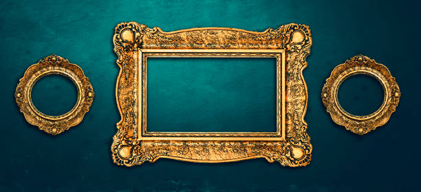 istock Vintage luxury golden frames set with ornate baroque decoration on rustic textured wall background. 1629041042
