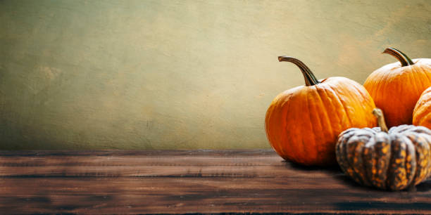 istock Thanksgiving still life with autumn pumpkins on vintage table 1629043747